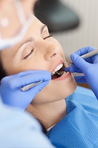 Relaxed patient receiving oral surgery treatment