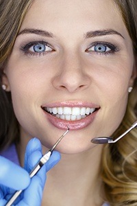 Closeup of patient receiving dental exam