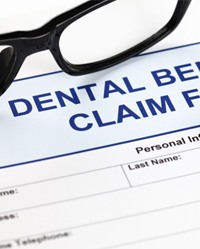 A dental insurance form marking the cost of tooth extraction in Weatherford