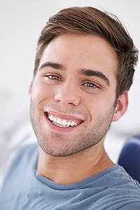 Man in dental chair smiling