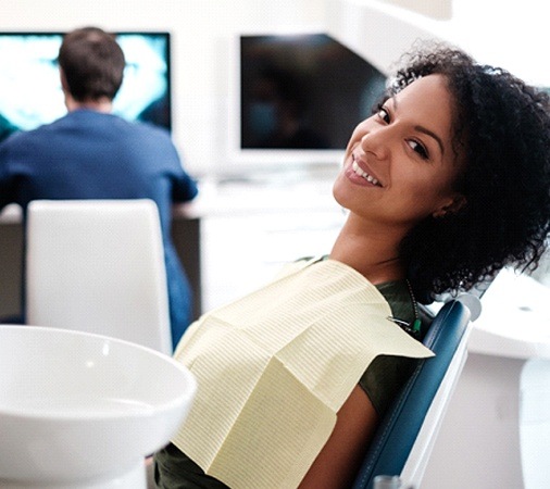 A young woman smiling in the dentist’s chair