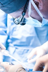 A dental professional performing a procedure on a patient