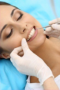 Woman receiving dental treatment