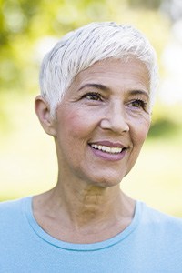 Older woman smiling outdoors