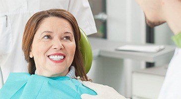 Smiling older woman in dental chair