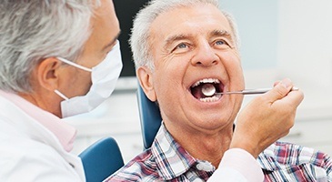 Older man receiving gum treatment