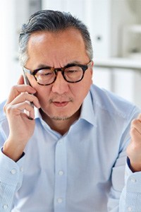 man calling oral surgeon