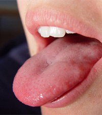 closeup of woman’s tongue 