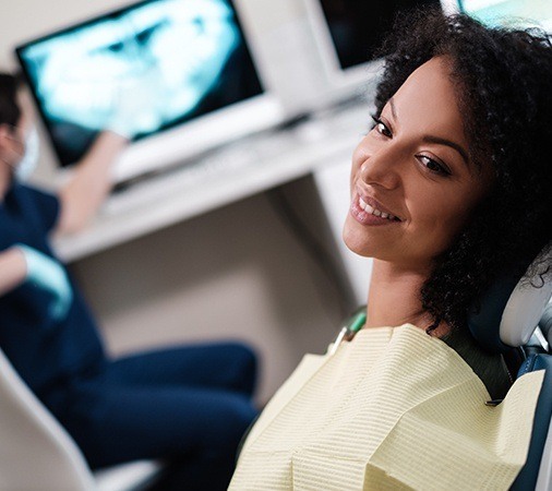 Smiling woman in dental chair