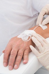 Patient's hand with IV drip in place
