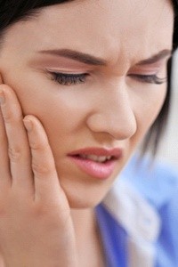 Woman with jaw pain