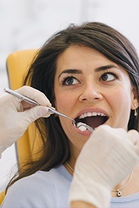 Woman receiving dental exam