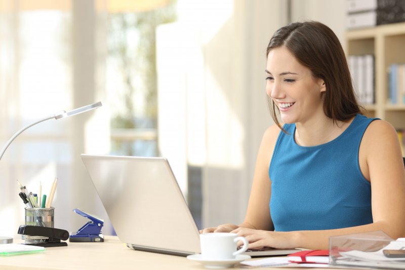 A woman learning about dental implant technology.