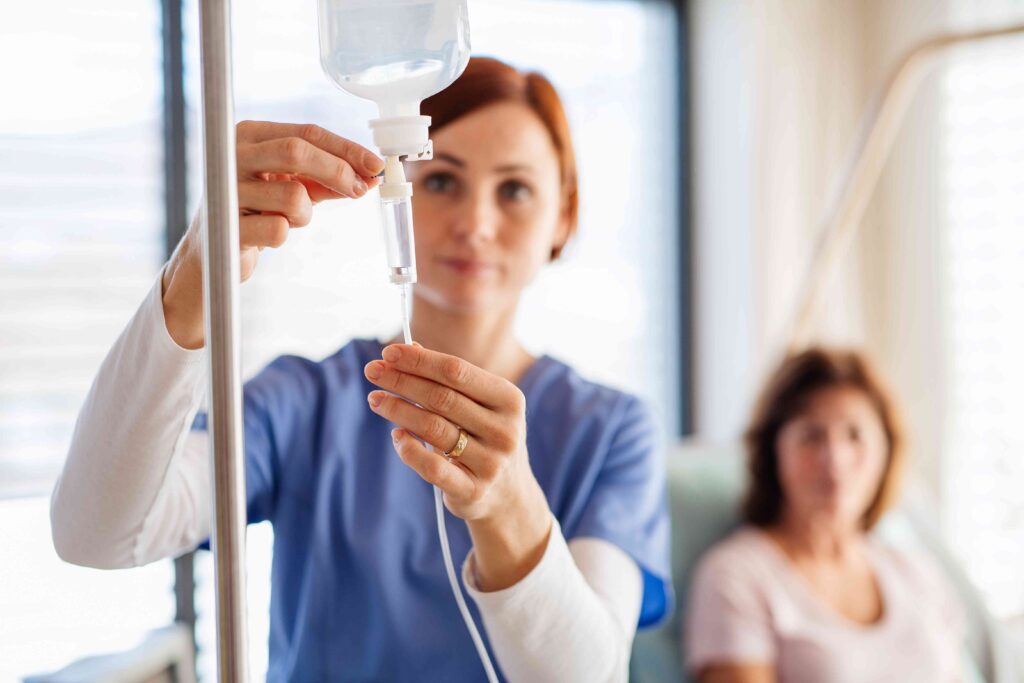 Woman setting up an IV